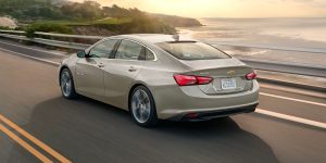2024 Chevrolet Malibu cruising sea-side